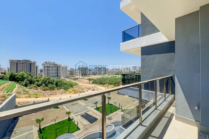 Приобрести Двухкомнатная квартира с чистовой отделкой в новом комплексе - район Махмутлар, Алания 10 