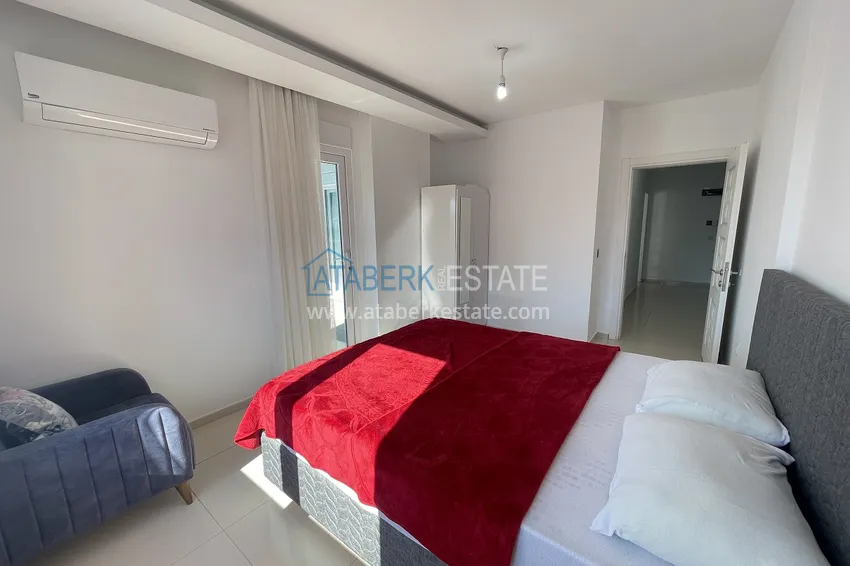 Приобрести Меблированная трехкомнатная квартира в районе Тосмур, Алания 12 