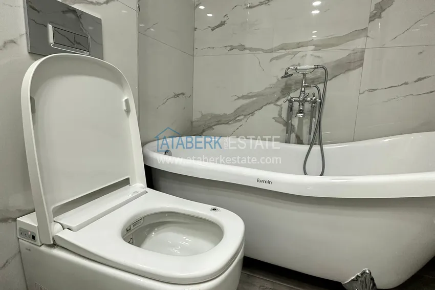 Приобрести Квартира в Махмутларе с дизайнерским интерьером и прямым видом на море 15 