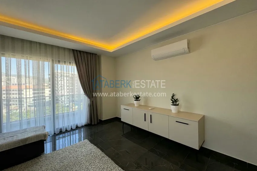 Приобрести Квартира 1+1 с мебелью и видом на горы. Новостройки Алании, район Махмутлар 2 