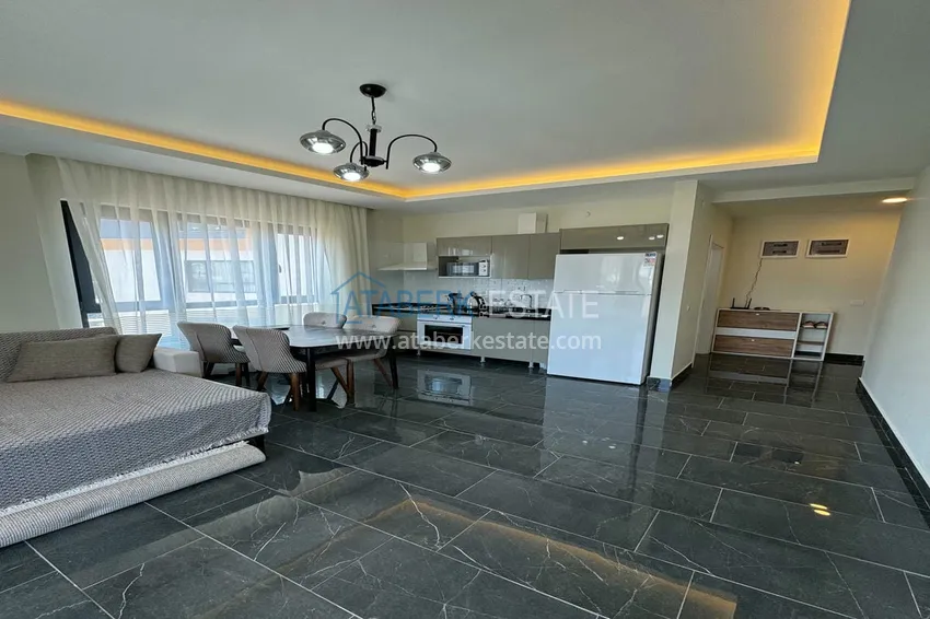 Приобрести Квартира 1+1 с новой мебелью и видом на горы в современном комплексе - район Махмутлар, Алания 3 