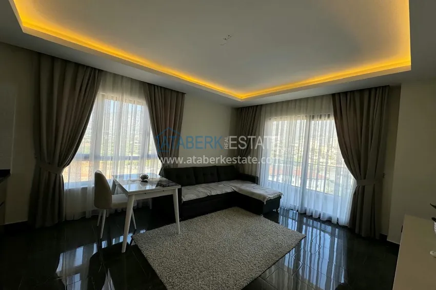 Приобрести Квартира 1+1 с мебелью и видом на горы. Новостройки Алании, район Махмутлар 3 