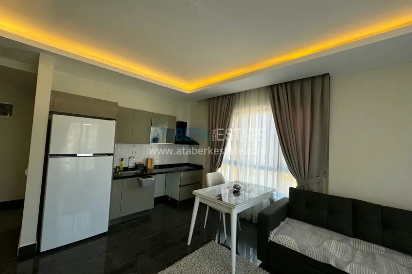 Приобрести Квартира 1+1 с мебелью и видом на горы. Новостройки Алании, район Махмутлар 5 