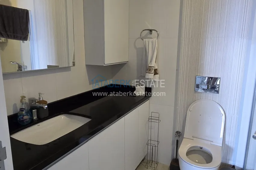 Приобрести Трехкомнатная квартира в комплексе класса люкс, на первой береговой линии – район Махмутлар, Алания 9 