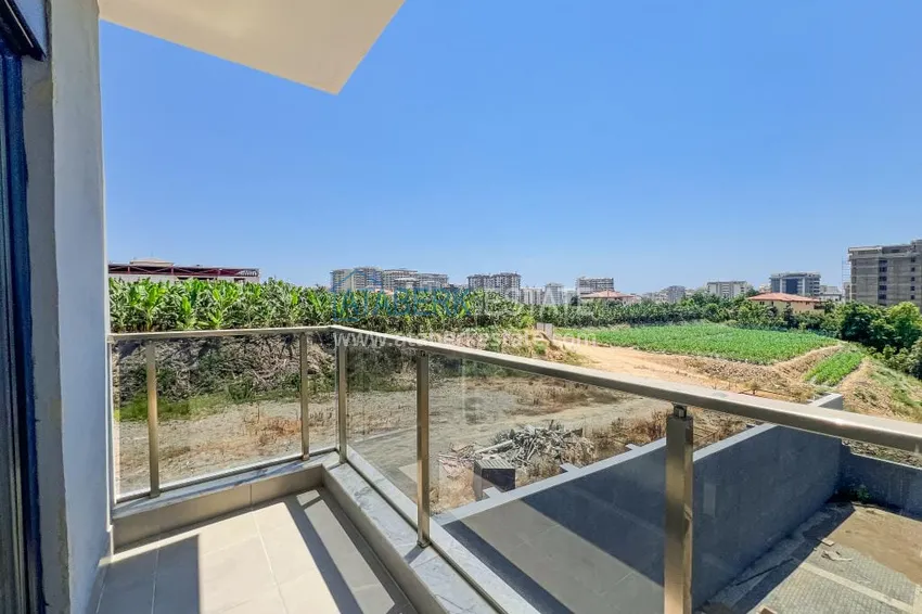 Приобрести Двухкомнатная квартира с чистовой отделкой в новом комплексе - район Махмутлар, Алания 9 