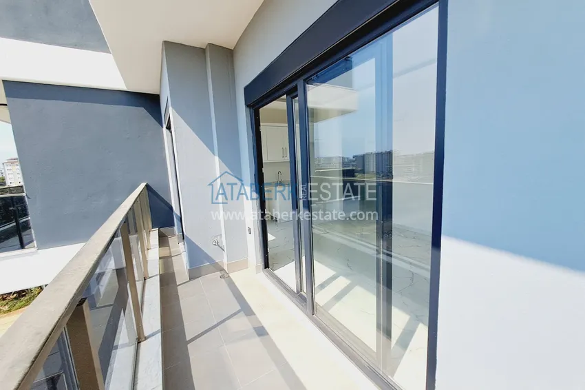 Приобрести Двухкомнатная квартира от инвестора в строящемся жилом комплексе - Махмутлар 10 