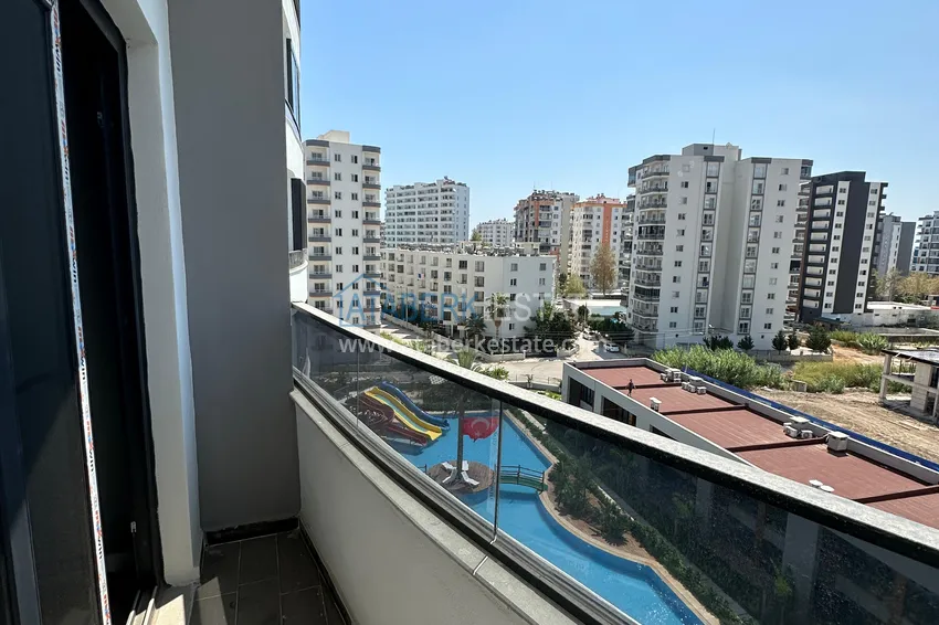 Приобрести Двухкомнатная квартира в Мерсине, район Арпачбахшиш в 300 метрах от моря 10 