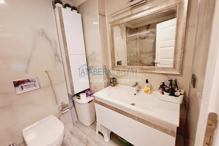 Приобрести Трехкомнатная квартира с видом в уютном жилом комплексе. Район Джикджилли, Алания 11 