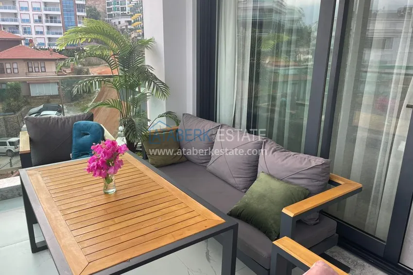 Приобрести Двухкомнатная квартира с мебелью и видом на море. Район Каргыджак, Алания 12 