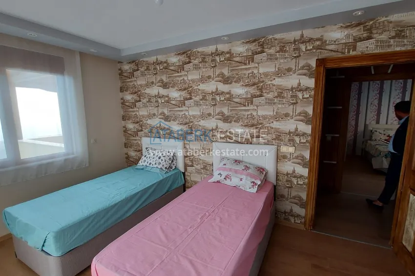 Приобрести Двухэтажная смежная вилла с панорамным видом в районе Бекташ, Алания. Недвижимость подходит для гражданства 10 