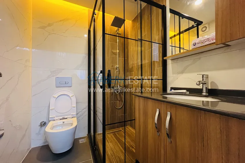 Приобрести Квартира в Махмутларе на центральной улице – современный интерьер, в 100 метрах от моря 13 