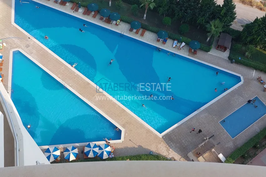 Приобрести Трехкомнатная квартира с мебелью и панорамным видом на море в Чешмели, Мерсин 13 