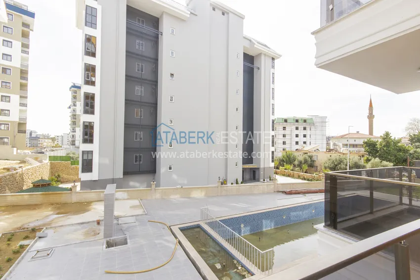 Приобрести Двухкомнатная квартира с чистовой отделкой - Алания, район Авсаллар 13 