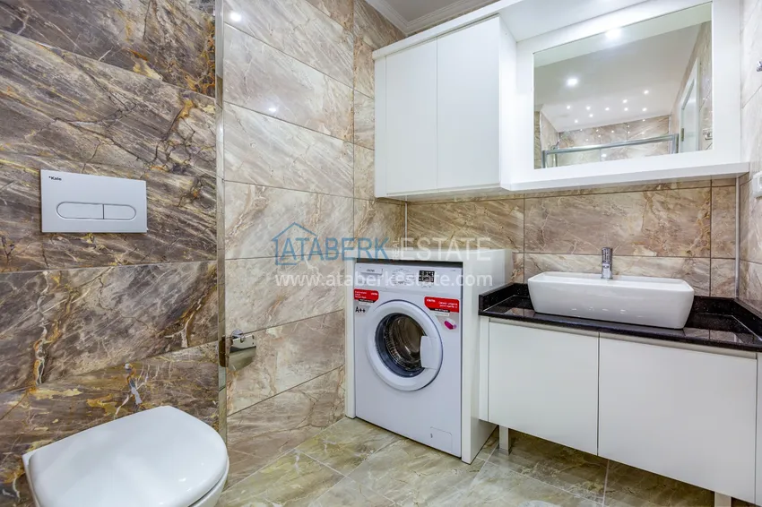 Приобрести Трехкомнатная квартира под ключ в Махмутларе, с видом на горы и застекленным балконом 14 