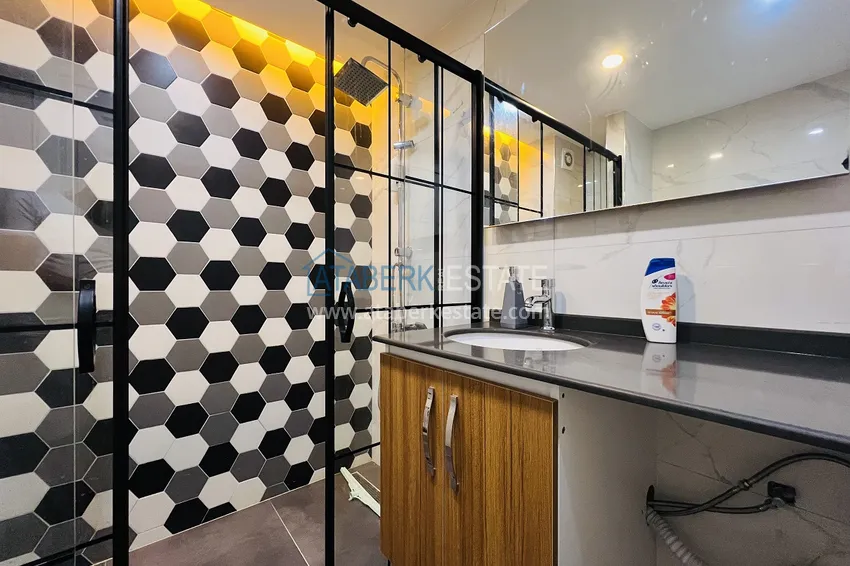 Приобрести Квартира в Махмутларе на центральной улице – современный интерьер, в 100 метрах от моря 14 