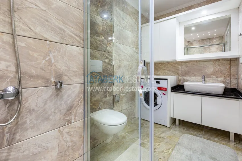 Приобрести Трехкомнатная квартира под ключ в Махмутларе, с видом на горы и застекленным балконом 15 