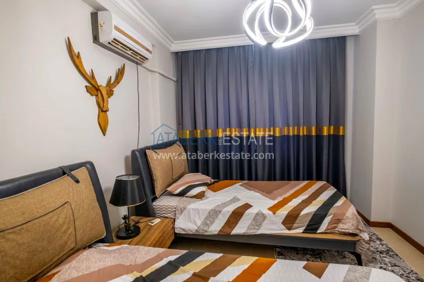 Приобрести Трёхкомнатная квартира в комплексе на первой береговой, район Махмутлар – Алания 13 