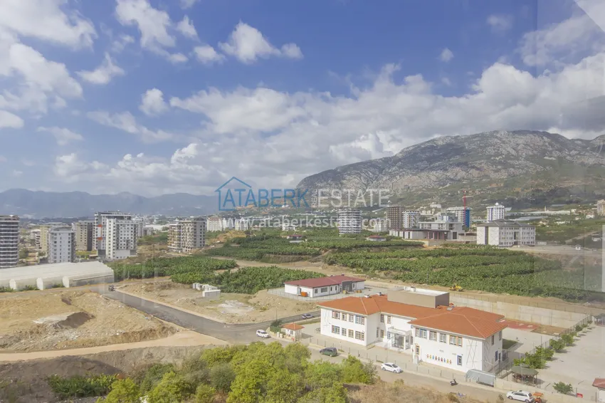 Приобрести Трехкомнатная квартира под ключ в Махмутларе, с видом на горы и застекленным балконом 20 