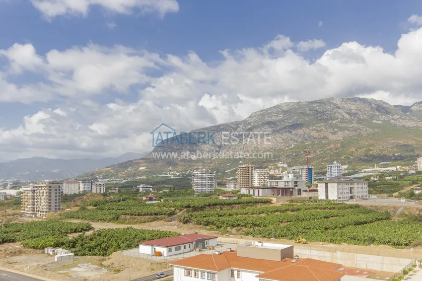 Приобрести Трехкомнатная квартира под ключ в Махмутларе, с видом на горы и застекленным балконом 21 