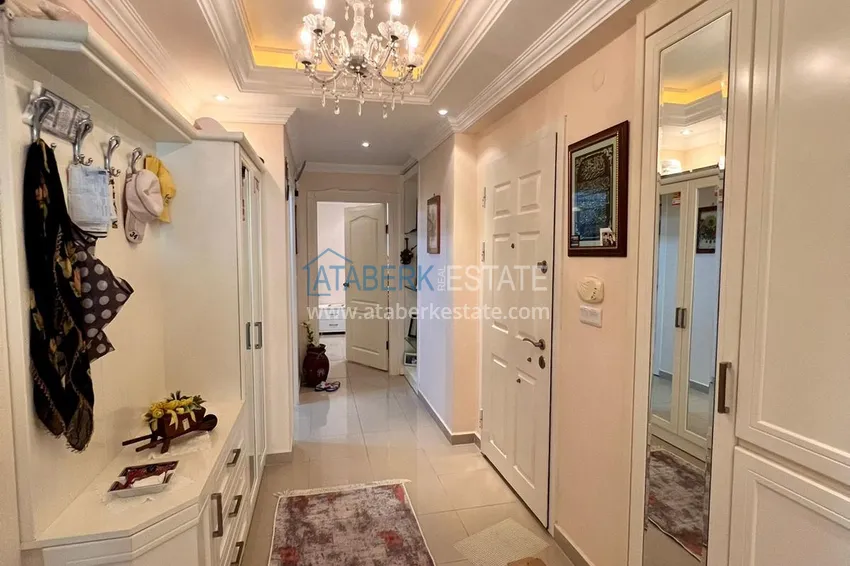 Приобрести Трехкомнатная квартира в Махмутларе с мебелью в комплексе на первой береговой линии 1 