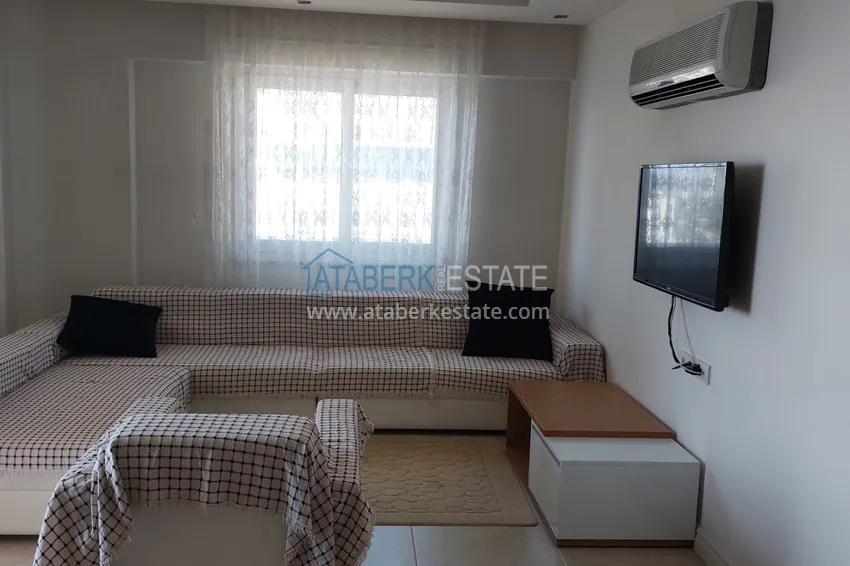 Приобрести Трехкомнатная квартира с мебелью и панорамным видом на море в Чешмели, Мерсин 1 