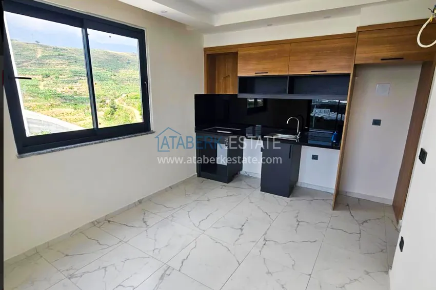 Приобрести Трёхкомнатная квартира с видом на море и горы – Алания, район Махмутлар 1