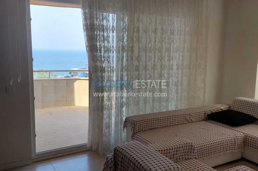 Приобрести Трехкомнатная квартира с мебелью и панорамным видом на море в Чешмели, Мерсин 2 