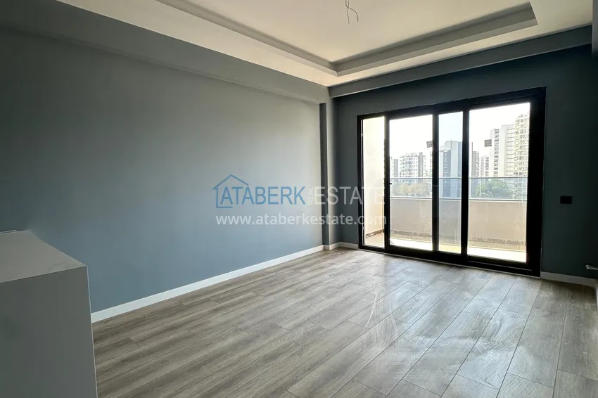 Приобрести Двухкомнатная квартира в Мерсине, район Арпачбахшиш в 300 метрах от моря 2 