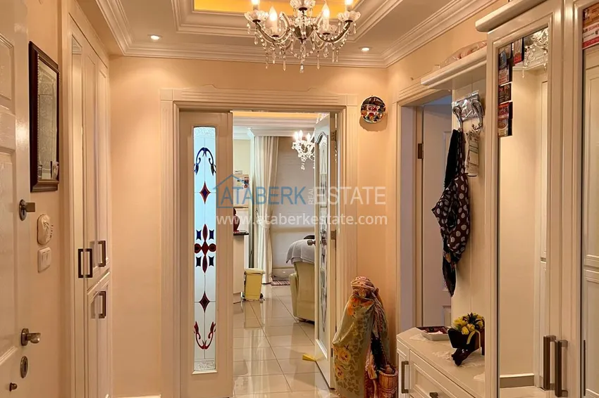 Приобрести Трехкомнатная квартира в Махмутларе с мебелью в комплексе на первой береговой линии 2 