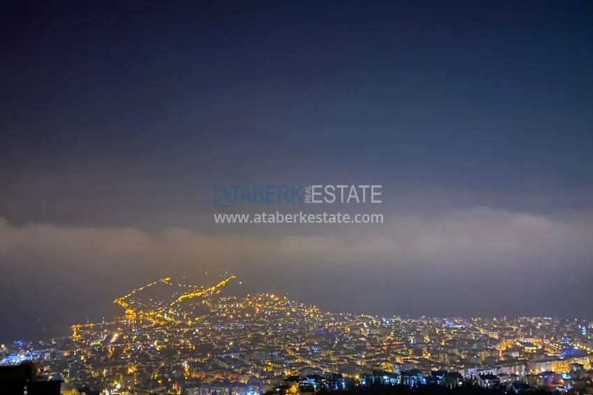 Приобрести Двухэтажная смежная вилла с панорамным видом в районе Бекташ, Алания. Недвижимость подходит для гражданства 32 