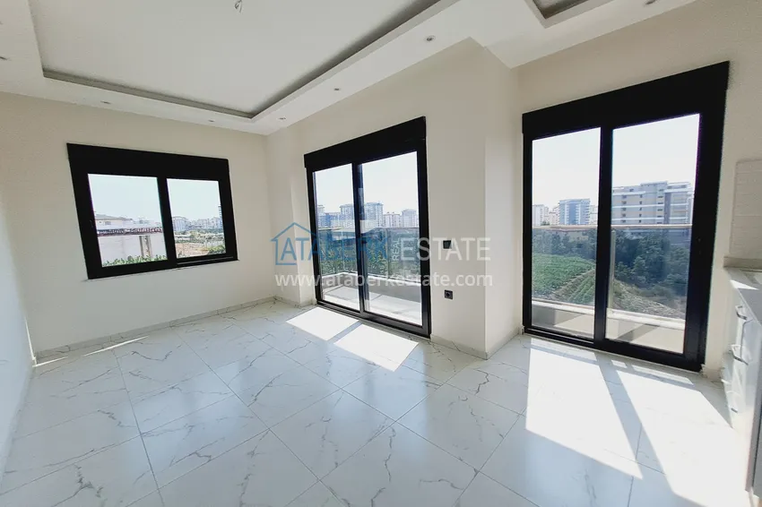 Приобрести Двухкомнатная квартира от инвестора в строящемся жилом комплексе - Махмутлар 3 