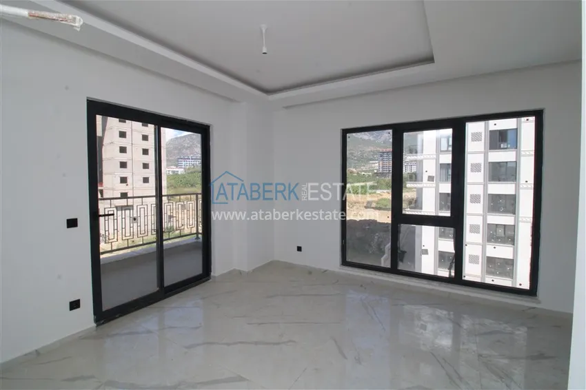 Приобрести Двухкомнатные квартиры с чистовой отделкой в районе Махмутлар, Алания 3 