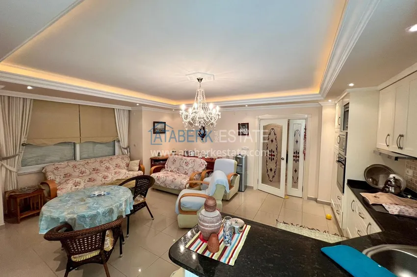 Приобрести Трехкомнатная квартира в Махмутларе с мебелью в комплексе на первой береговой линии 3 