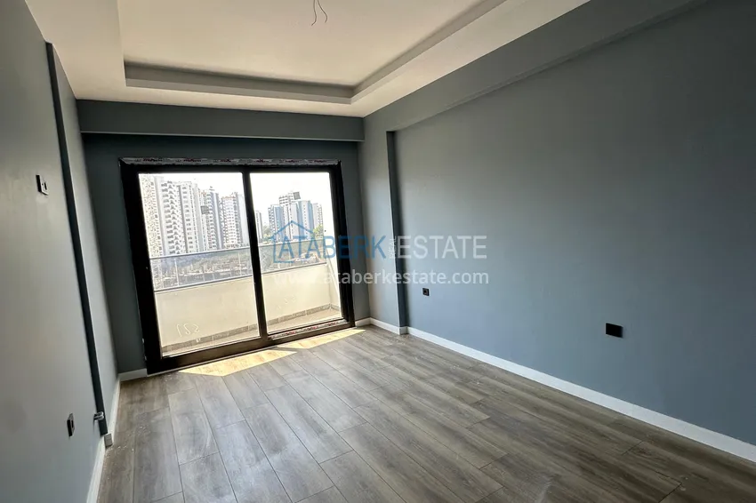 Приобрести Двухкомнатная квартира в Мерсине, район Арпачбахшиш в 300 метрах от моря 5 