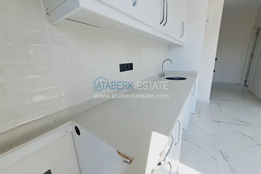 Приобрести Двухкомнатная квартира от инвестора в строящемся жилом комплексе - Махмутлар 6 