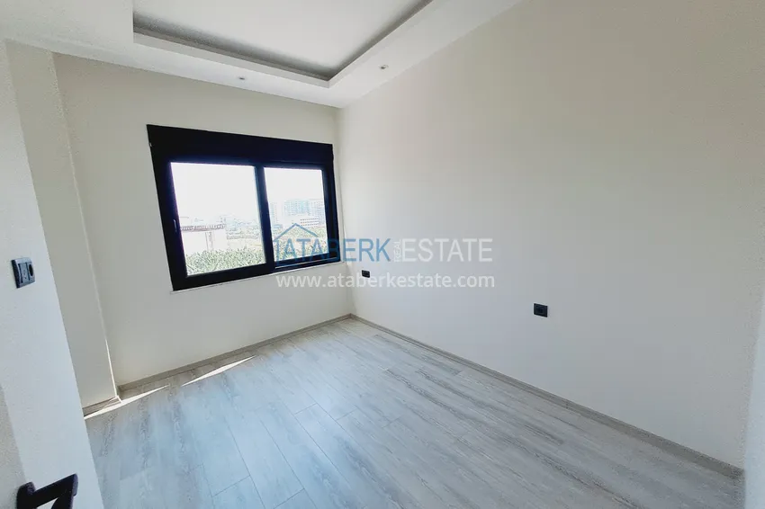 Приобрести Двухкомнатная квартира от инвестора в строящемся жилом комплексе - Махмутлар 7 