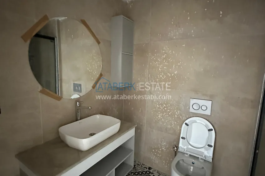 Приобрести Двухкомнатная квартира в Мерсине, район Арпачбахшиш в 300 метрах от моря 7 