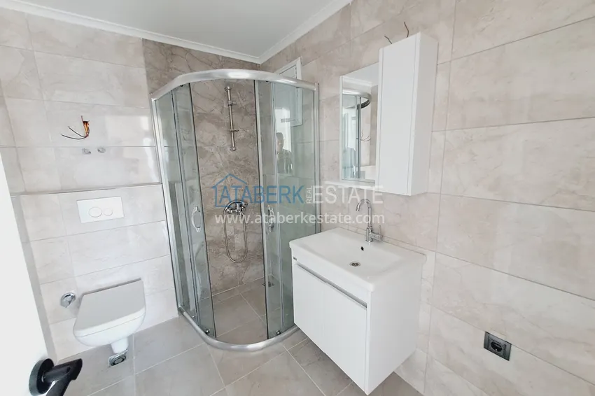 Приобрести Двухкомнатная квартира от инвестора в строящемся жилом комплексе - Махмутлар 8 