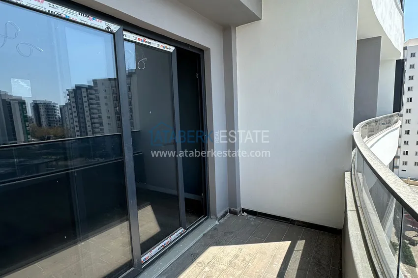 Приобрести Двухкомнатная квартира в Мерсине, район Арпачбахшиш в 300 метрах от моря 8 