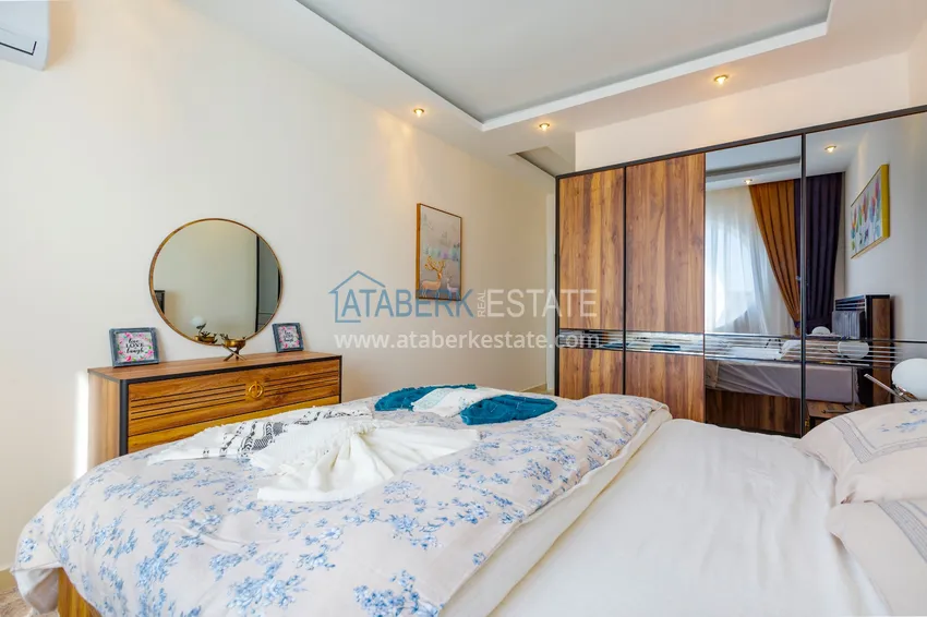 Приобрести Трехкомнатная квартира под ключ в Махмутларе, с видом на горы и застекленным балконом 9 