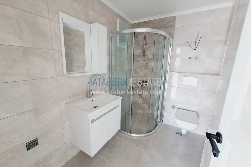 Приобрести Двухкомнатная квартира от инвестора в строящемся жилом комплексе - Махмутлар 9 