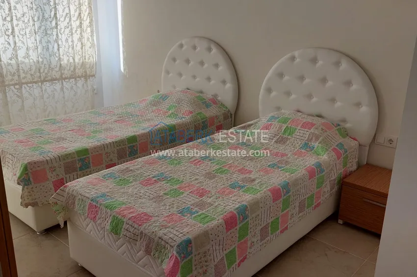 Приобрести Трехкомнатная квартира с мебелью и панорамным видом на море в Чешмели, Мерсин 9 