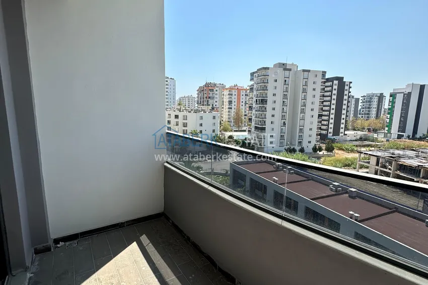 Приобрести Двухкомнатная квартира в Мерсине, район Арпачбахшиш в 300 метрах от моря 9 