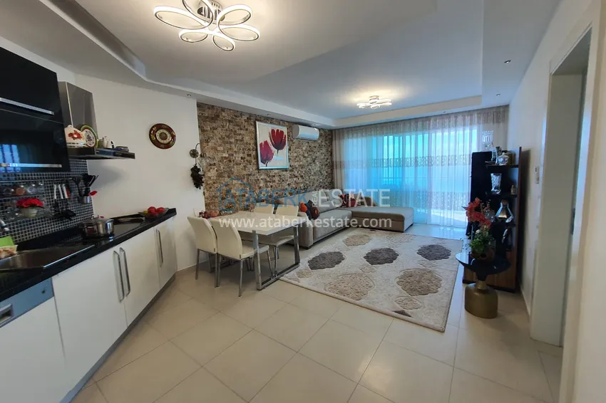 Приобрести Двухкомнатная квартира с застеклённым балконом и видом на море, первая береговая линия - район Кестель, Алания 1 