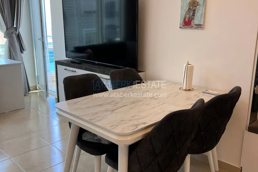 Приобрести Квартира в Махмутларе с мебелью и застекленным балконом в комплексе премиум-класса 2 