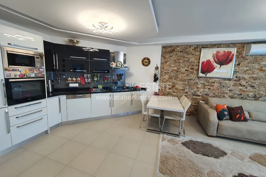 Приобрести Двухкомнатная квартира с застеклённым балконом и видом на море, первая береговая линия - район Кестель, Алания 2 