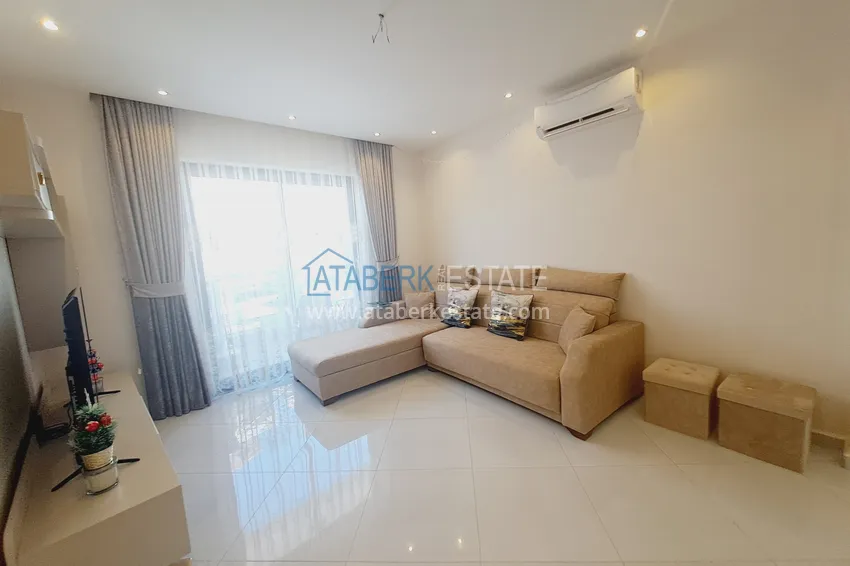 Приобрести Квартира 1+1 с мебелью и видом на горы в комплексе с отельной инфраструктурой, район Махмутлар – Алания 2 