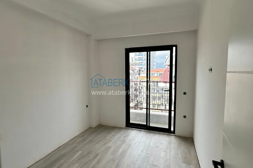 Приобрести Двухкомнатная квартира с чистовой отделкой в новом жилом комплексе - Махмутлар, Алания 3 