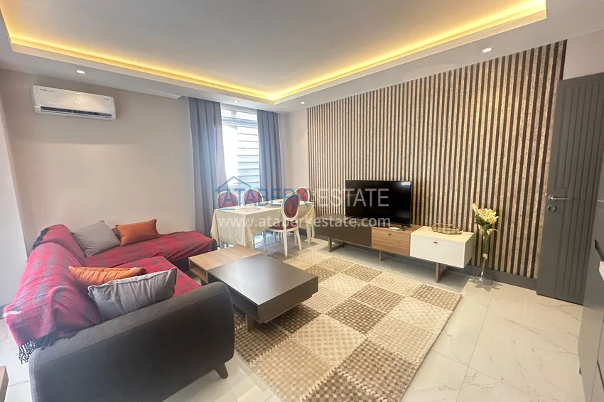 Приобрести Просторная двухкомнатная квартира с мебелью в центре Алании, район пляжа Клеопатра 4 