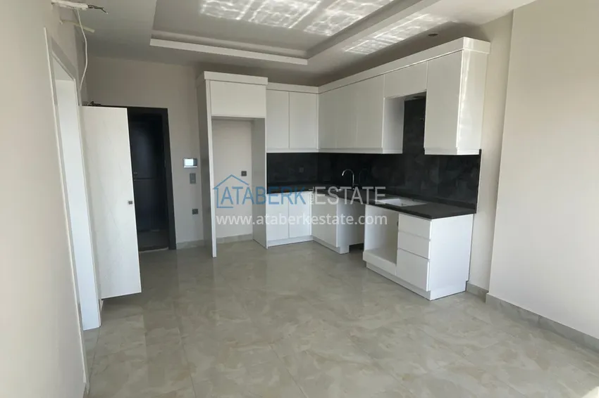 Приобрести Двухкомнатная квартира с открытым видом на море, район Махмутлар – Алания 3